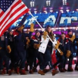 American athletes walk into the Opening Ceremony led by flag bearer Erin Hamlin who competed in Luge.