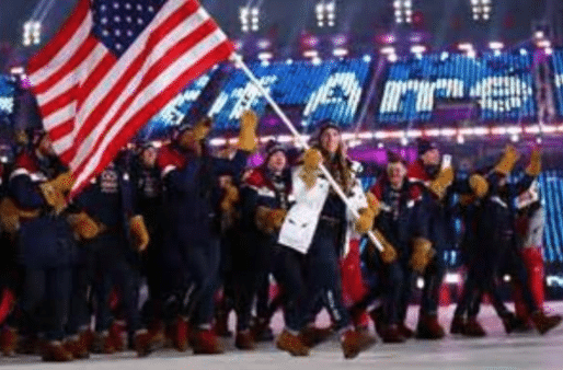 American athletes walk into the Opening Ceremony led by flag bearer Erin Hamlin who competed in Luge.