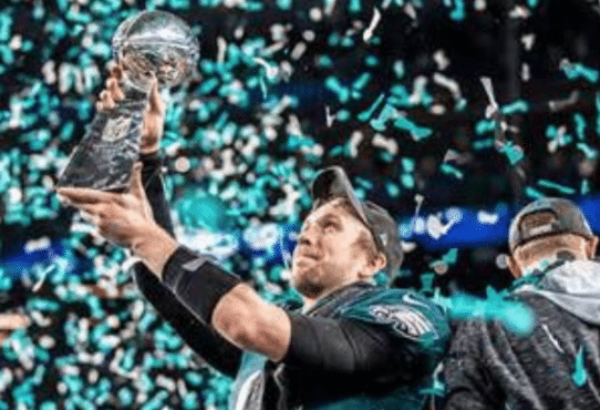 Nick Foles, named Super Bowl MVP, holds up the Lombardi trophy, the first for both himself and the Eagles franchise.
